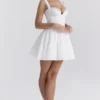 Abito mini a corsetto Brigitte in cotone bianco con ricamo inglese